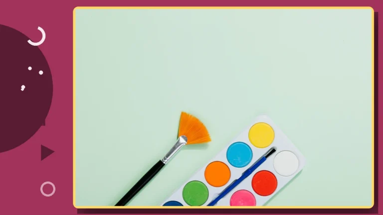 A watercolor paint palette and brush on a plain background.
