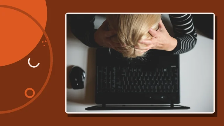 A person slumped head-in-hands over a laptop, illustrating the frustration of relying on ineffective solutions.
