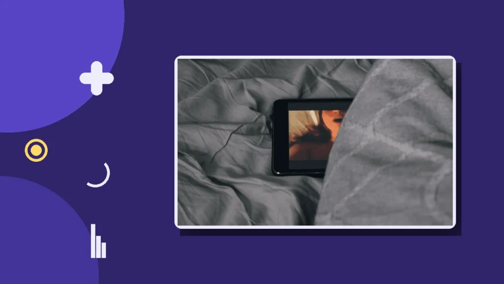 A smartphone glowing on rumpled bedsheets, illustrating secret phone use and betrayal in a relationship.