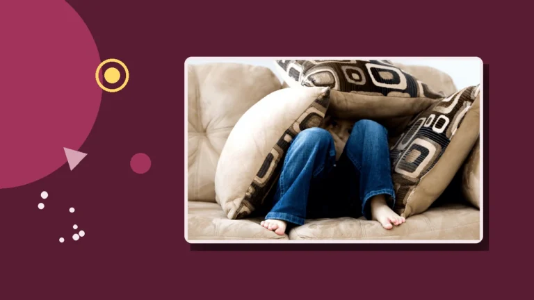 A child huddled and hiding under couch cushions, illustrating the effects on children growing up in a high-conflict home.