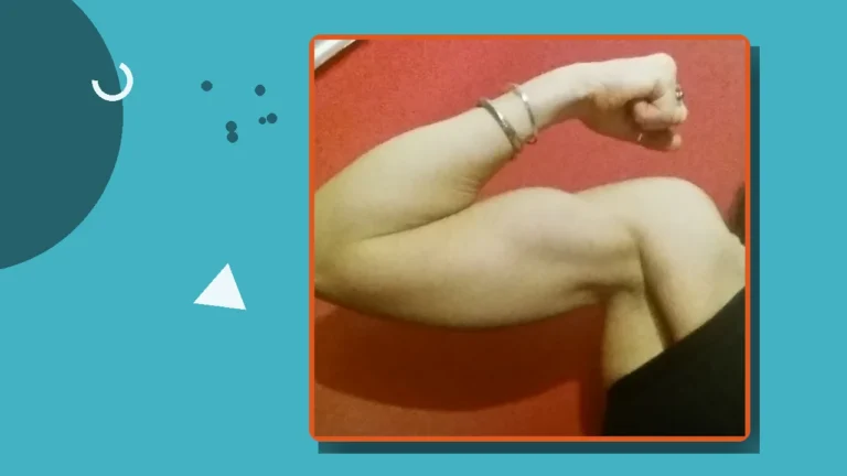 A flexed arm showing strength, illustrating trauma recovery and the importance of caring for the body while healing.